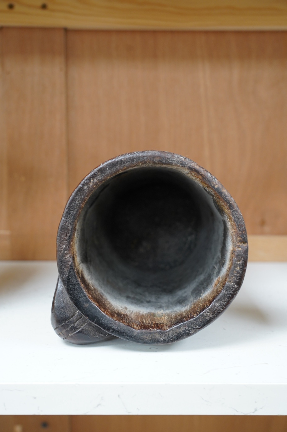 A Scandinavian carved wood tankard, lacking lid, 24cm. Condition - commensurate with age